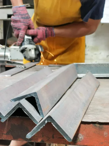 metal-processing-with-angle-grinder-man-cutting-mild-steel-angle-bars